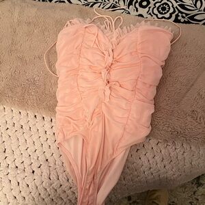 Women’s pink bodysuit honey
